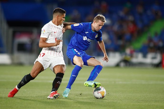 Jakub Jankto of Getafe and Erik Lamela of Sevilla in action during spanish league, La Liga Santander, football match played between Getafe CF and Sevilla FC at Coliseo Alfonso Perez Stadium on August 23, 2021, in Getafe, Madrid, Spain.