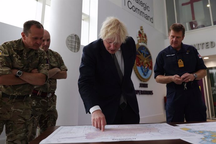 26 August 2021, United Kingdom, London: UK Prime Minister Boris Johnson observes the operations room for the Afghan Relocation and Assistance Policy during a visit to the Northwood Headquarters, the British Armed Forces Permanent Joint Headquarters, whe