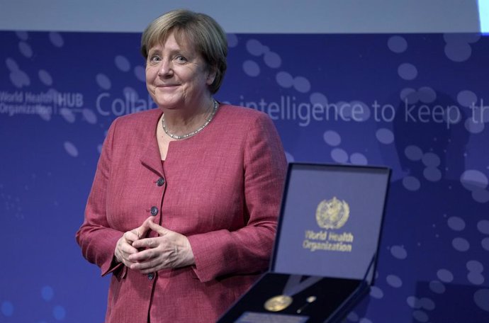 01 September 2021, Berlin: German Chancellor Angela Merkel smiles before receiving a medal from the Director-General of the World Health Organization (WHO) during the inauguration ceremony of the "WHO Hub For Pandemic And Epidemic Intelligence". The hub