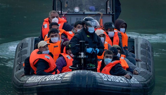 06 September 2021, United Kingdom, Dover: A group of people thought to be migrants are brought into Dover by Border Force officers, following a small boat incident in the English Channel. Photo: Gareth Fuller/PA Wire/dpa