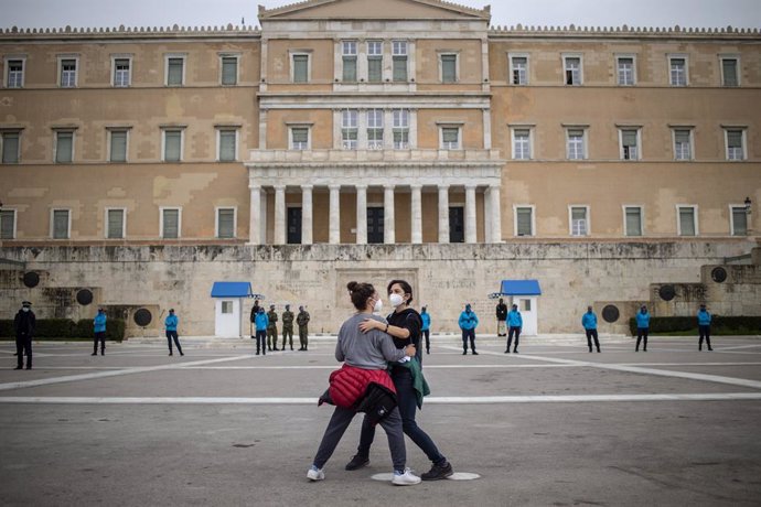 Archivo - 08 March 2021, Greece, Athens: Two women take part in a rally in front of the parliament building held on the occasion of the International Women's Day. Photo: Angelos Tzortzinis/dpa