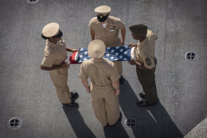 11 September 2021, US, New York: Marines fold an American flag during a commemoration ceremony for the 20th anniversary of the 9/11 terrorist attacks on the World Trade Center. Photo: Sgt. Alexis Flores/U.S. Marines/Planet Pix via ZUMA Press Wire/dpa