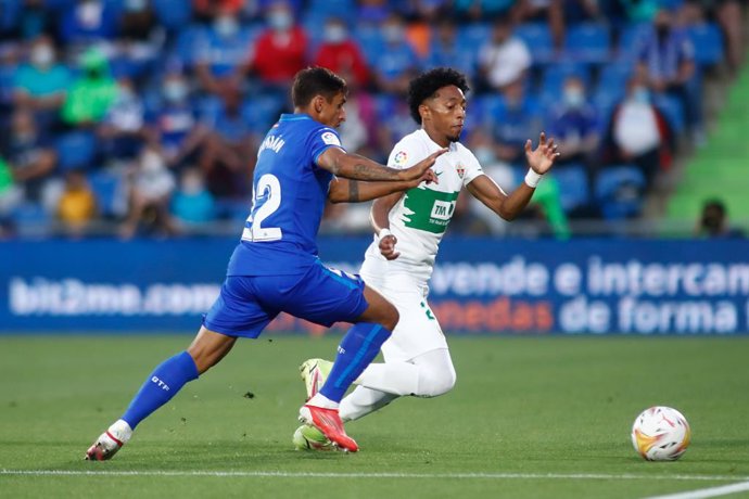 Johan Mojica of Elche and Damian Suarez of Getafe in action during the spanish league, La Liga Santander, football match played between Getafe CF and Elche CF at Coliseo Alfonso Perez stadium on September 13, 2021, in Getafe, Madrid, Spain.