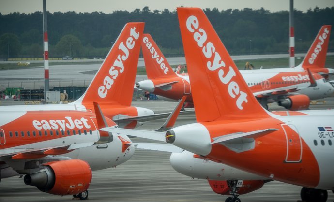 29 April 2020, Brandenburg, Berlin: Easy Jet aircraft are parked on the apron of the new Berlin-Brandenburg Willy-Brandt Airport. Photo: Michael Kappeler/dpa