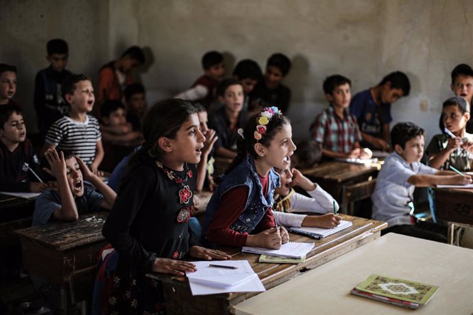 20 September 2021, Syria, Afes: Students start school work in Afes town school at the beginning of the school year in Idlib Governorate, despite the poor conditions due to an air raid that hit and partially destroyed the school in 2019. Photo: Anas Alkh