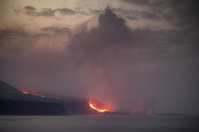 The lava delta of Cumbre Vieja, from the port of Tazacorte, on October 1, 2021, in La Palma, Santa Cruz de Tenerife, Canary Islands (Spain).  The lava from the volcano began on September 28 to gain ground from the sea, forming a delta of 50 meters d