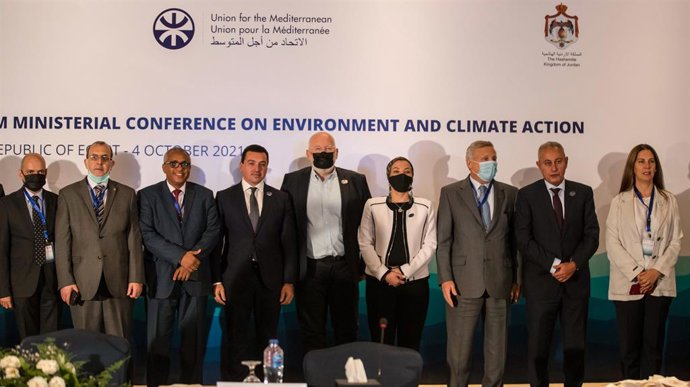 European Commission Vice-President Frans Timmermans (C) poses with delegations for a group photo in the end of the opening session of  the UfM Conference on Environment and Climate Action in Cairo on October 4, 2021.