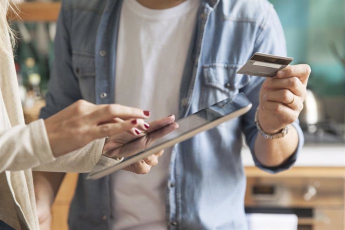 A customer pays with a credit card on a tablet