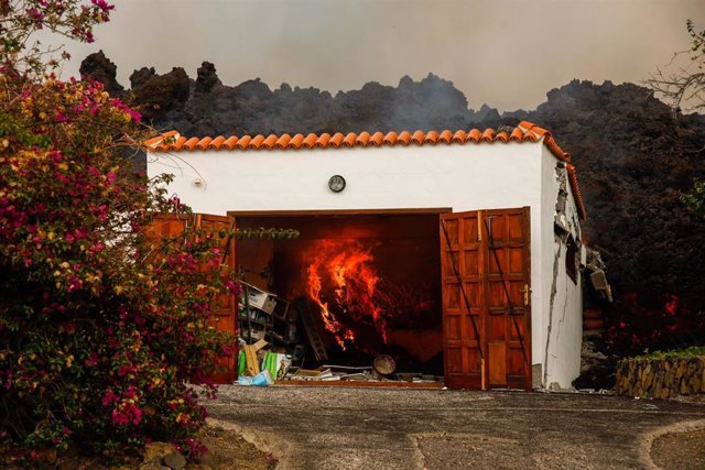 Lava from the volcano destroys a house in the Los Llanos area, on September 20, 2021, in El Paso, La Palma, Santa Cruz de Tenerife, Canary Islands, (Spain).  The volcanic eruption that began yesterday at 4:00 p.m. in the Cabeza de Vaca area (La Palma), 
