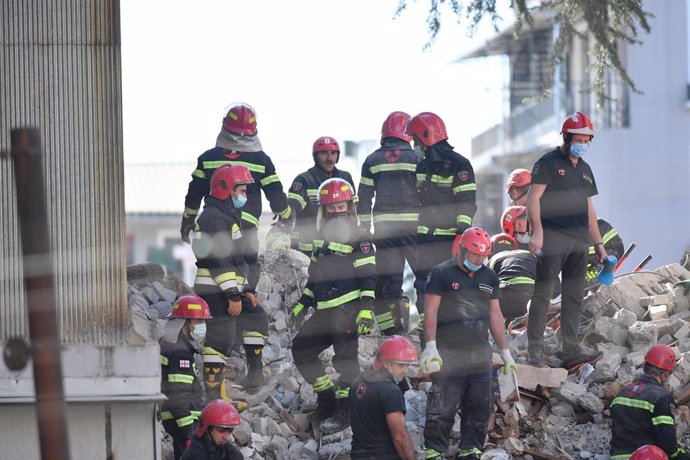 (211008) -- BATUMI, Oct. 8, 2021 (Xinhua) -- Rescuers work on the ruins of the collapsed building in Batumi, Georgia, Oct. 8, 2021. A multi-block residential building collapsed on Friday in Georgia's western coastal city of Batumi, leaving several peopl