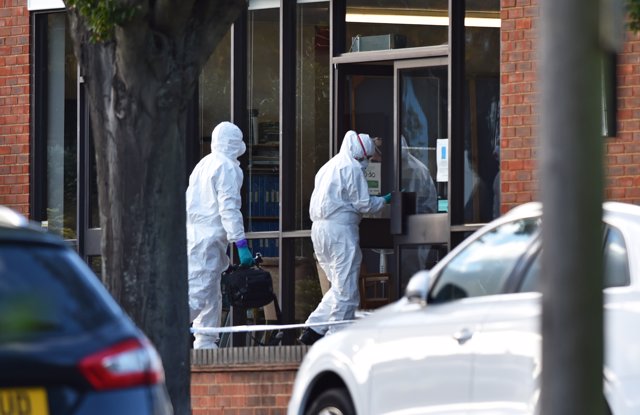 15 October 2021, United Kingdom, Leigh-On-Sea: Forensics officers on duty at the scene near the Belfairs Methodist Church in Eastwood Road North, where Conservative lawmaker Sir David Amess has died. Photo: Nick Ansell/PA Wire/dpa