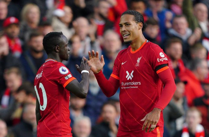 03 October 2021, United Kingdom, Liverpool: Liverpool's Sadio Mane (L) celebrates with Virgil van Dijk after scoring their side's first goal during the English Premier League soccer match between Liverpool and Manchester City at Anfield Stadium. Photo: 