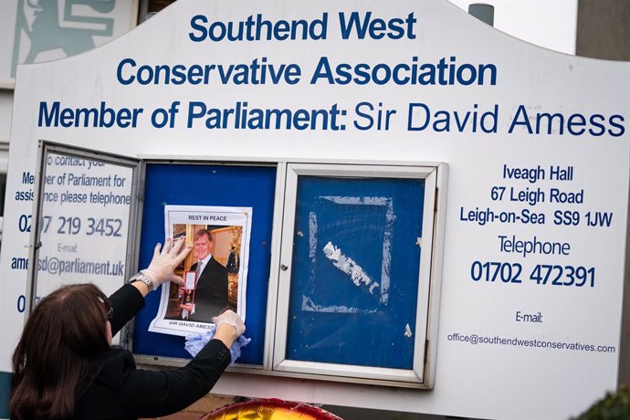 18 October 2021, United Kingdom, Leigh-On-Sea: A photograph of Conservative lawmaker Sir David Amess is placed on a noticeboard outside the Iveagh Hall, the home of the Southend West Conservative Association in Leigh-on-Sea. The Conservative lawmaker Si