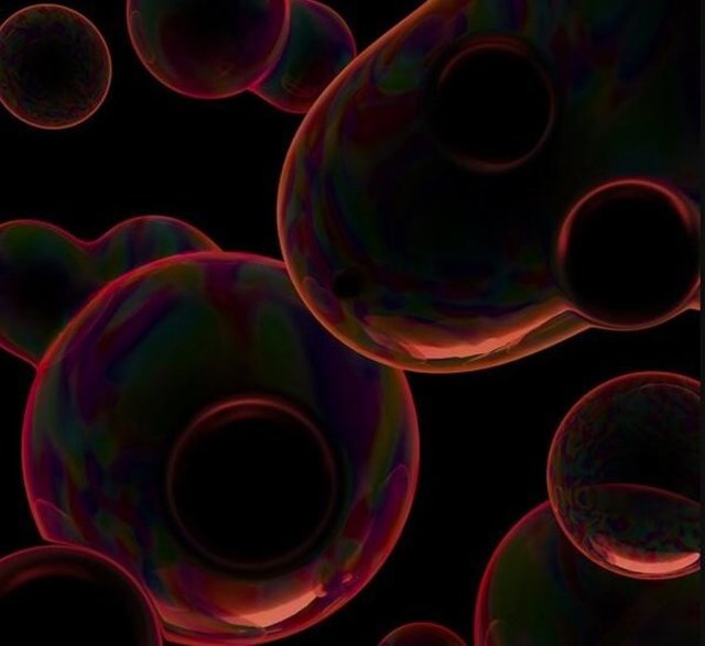 La impresión de un artista de las burbujas en colisión que pueden producir ondas gravitacionales de frecuencia extremadamente baja durante una transición de fase cosmológica en el Universo temprano.