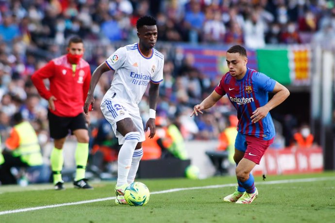 Vinicius Junior of Real Madrid and Sergino Dest of FC Barcelona in action during the spanish league, La Liga Santander, football match played between FC Barcelona and Real Madrid at Camp Nou stadium on October 24, 2021, in Barcelona, Spain.