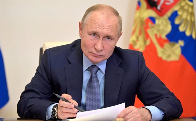HANDOUT - 20 October 2021, Russia, Moscow: Russian President Vladimir Putin holds a videoconference meeting with members of the Russian Government. Photo: -/Kremlin/dpa - ATTENTION: editorial use only and only if the credit mentioned above is referenced