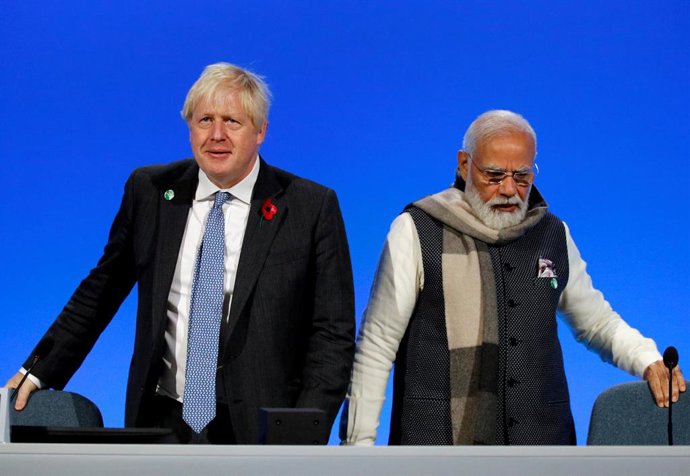 02 November 2021, United Kingdom, Glasgow: UK Prime Minister Boris Johnson (L) and Indian Prime Minister Narendra Modi co-chair a UK-India event to launch the Coalition for Disaster Resilient Infrastructure's Small Island Developing States' fund, during
