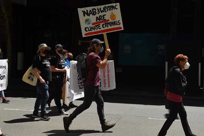 Protesters are seen during a rally to mark the Global Day of Action on Climate in Sydney, Saturday, November 6, 2021. A rally in Sydneys CBD marks the Global Day of Action on Climate, while global leaders meet at the COP26 talks in Glasgow. (AAP Image/
