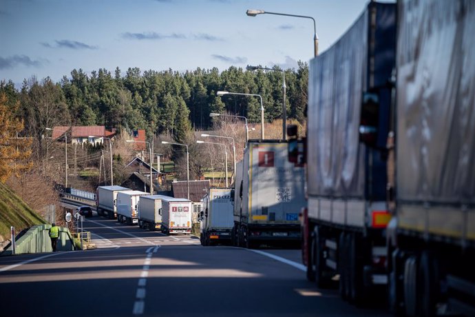 09 November 2021, Poland, Kuznica: Trucks wait outside the closed Kusnica border crossing on the border between Poland and Belarus.  The migration crisis at the Poland-Belarus border with refugees trying to enter the European Union via Belarus worsened 