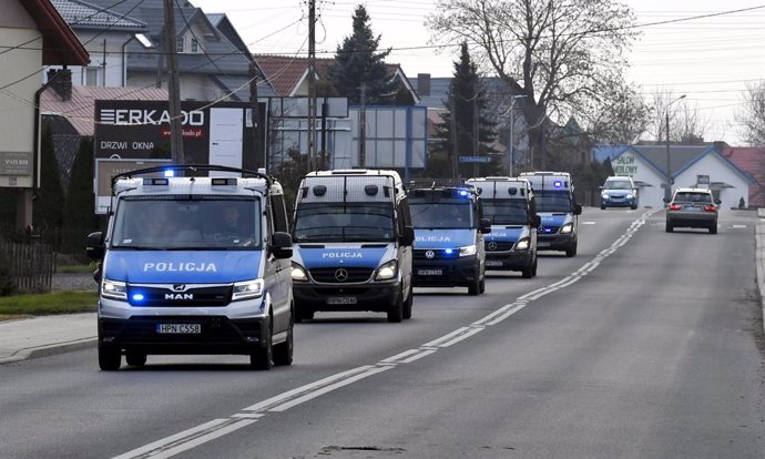 13 November 2021, Poland, Sokolka: Police vans make their way to the Polish-Belarusian border, that was closed because of a large group of migrants camping in the area on the Belarus side who had tried to illegally push their way into Poland and into th