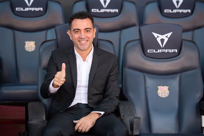 Xavi Hernandez poses for photo on the bend during his presentation as new head coach of FC Barcelona at Camp Nou stadium on November 08, 2021, in Barcelona, Spain.