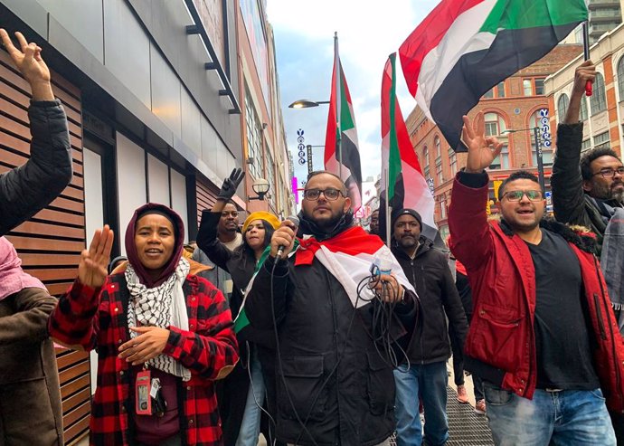 November 13, 2021, Toronto, Ontario, Canada: Sudanese pro-democracy protestors marched through downtown TorontoAs shopping distance to denounce the October 25 military coup that toppled SudanAs government. Waving and wearing SudanAs flag, they demand