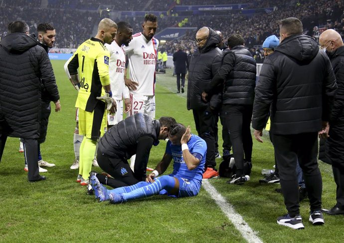 Match stopped by referee Ruddy Buquet after few minutes into the game when Dimitri Payet of OM (lying in blue jersey) received a plastic water bottle on the head thrown from the OL kop during the French championship Ligue 1 football match between Olympi