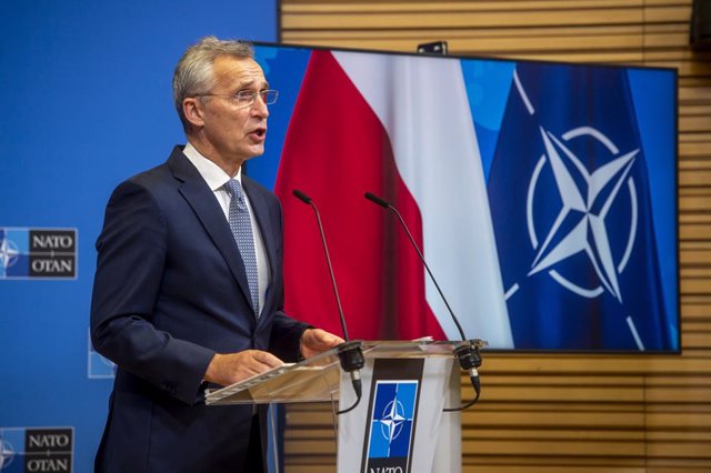 HANDOUT - 25 November 2021, Belgium, Brussels: Jens Stoltenberg (R), Secretary General of the North Atlantic Treaty Organizatio (NATO), speaks during a joint press conference with Poland's President Andrzej Duda following their meeting at the NATO headqua
