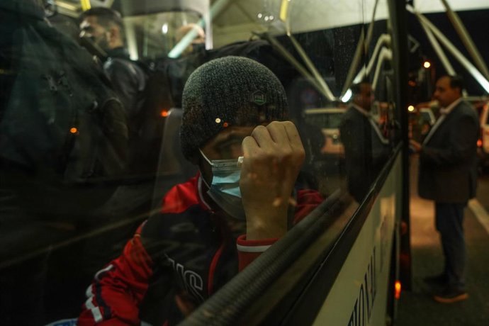18 November 2021, Iraq, Erbil: A man looks on after landing at the Erbil International Airport on board a repatriation flight that was sent by the Iraqi government to pick up migrants who were stranded for weeks on Belarus' border with EU member state P