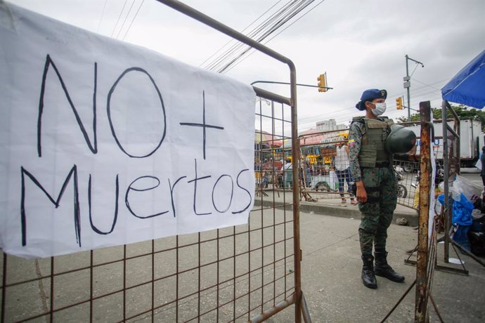 15 November 2021, Ecuador, Guayaquil: A general view of a placard reading "No more deaths" placed on the fence around the Guayas N1 detention centre, where clashes broke out between rival gangs. The Prisons in Ecuador are overcrowded and mostly controll