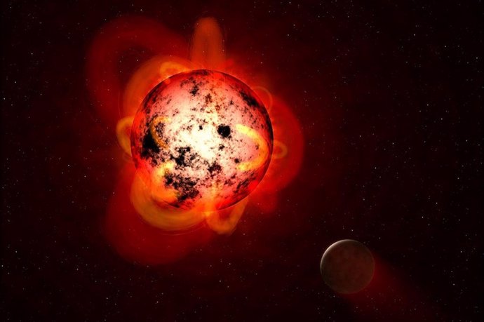 Ilustración de una estrella enana roja orbitada por un exoplaneta.