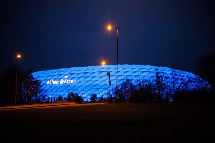 20 November 2021, Bavaria, Munich: The Allianz Arena is lit up in blue as part of a light campaign for International Children's Rights Day. Photo: Matthias Balk/dpa
