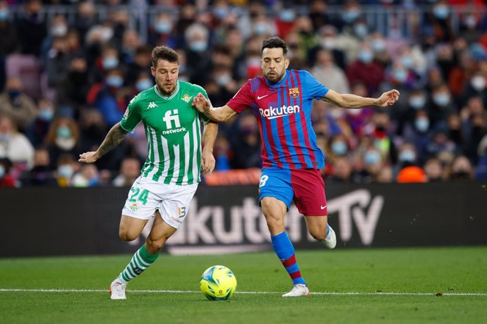 24 Aitor Rubial of Real Betis Balompie 18 Jordi Alba of FC Barcelona during the La Liga match between FC Barcelona and Betis at Camp Nou Stadium on December 04, 2021 in Barcelona.
