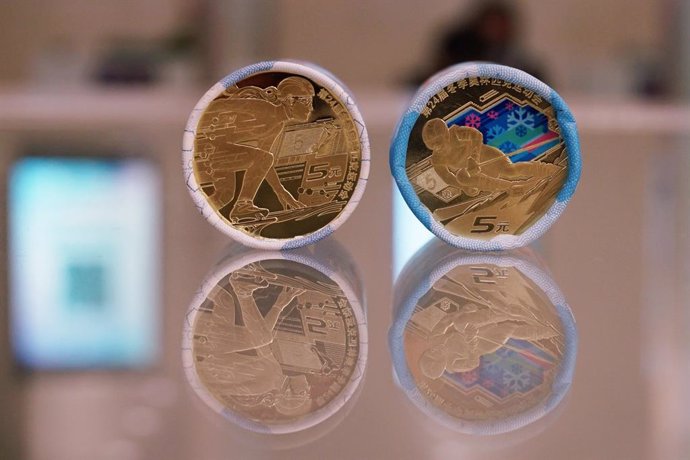 18 November 2021, China, Hangzhou: A general view of two sets of Chinese coins issued to commemorate the upcoming Beijing 2022 Winter Olympic Games. Photo: Long Wei/SIPA Asia via ZUMA Press Wire/dpa