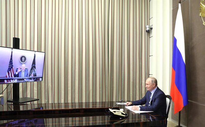 HANDOUT - 07 December 2021, Russia, Sochi: Russian President Vladimir Putin attends a video meeting with US President Joe Biden, from the Black Sea resort of Sochi. Photo: -/Kremllin/dpa - ATTENTION: editorial use only and only if the credit mentioned a