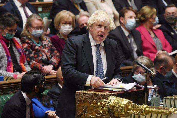 HANDOUT - 08 December 2021, United Kingdom, London: UKPrime Minister Boris Johnson speaks during the Prime Minister's Questions in the House of Commons. Photo: Jessica Taylor/Uk Parliament via PA Media/dpa - ATTENTION: editorial use only and only if th