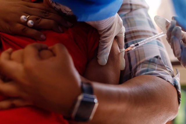 08 December 2021, Venezuela, Caracas: A child is inoculated against COVID-19 with the Cuban vaccine Soberana. Photo: Jesus Vargas/dpa