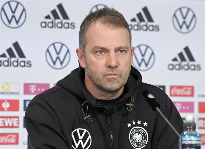 13 November 2021, Lower Saxony, Wolfsburg: Germany coach Hansi Flick speaks during a press conference after the final training session, ahead of Sunday's FIFA World Cup European qualifier soccer match against Armenia. Photo: Swen Pfrtner/dpa