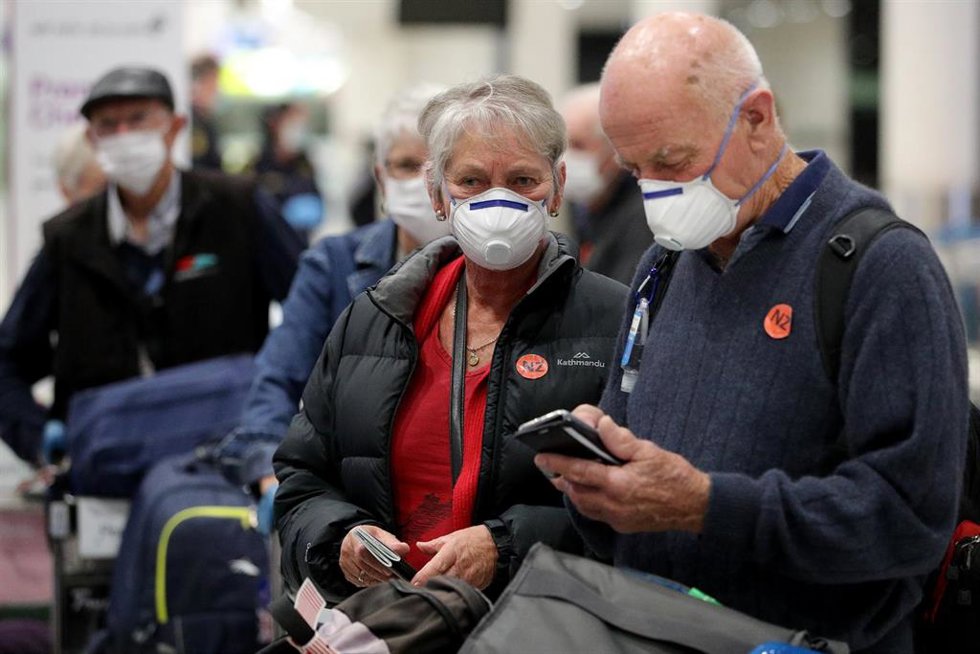 Archivo - Varias personas con mascarillas en Nueva Zelanda.