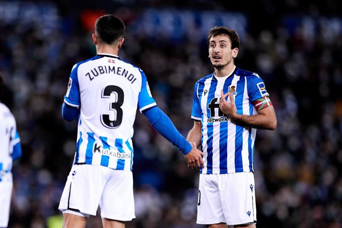 Martin Zubimendi of Real Sociedad talks to Mikel Oyarzabal during the Spanish league, La Liga, football match between Real Sociedad and Real Madrid CF at Reale Arena on 4 of december, 2021  in San Sebastian, Spain.