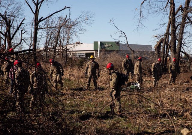 12 December 2021, US, Mayfield: Military personnel take part in search and rescue missions in the aftermath of tornadoes that tore through rural Kentucky. A powerful storm in the United States has wreaked havoc and left thousands without power, particular