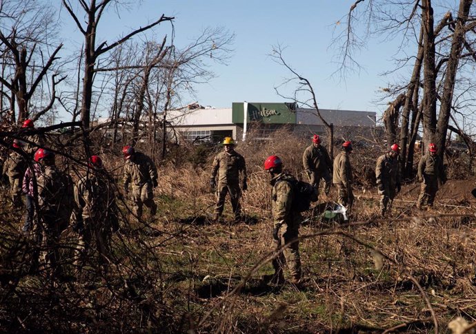 12 December 2021, US, Mayfield: Military personnel take part in search and rescue missions in the aftermath of tornadoes that tore through rural Kentucky. A powerful storm in the United States has wreaked havoc and left thousands without power, particul