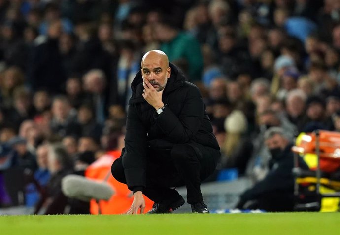 14 December 2021, United Kingdom, Manchester: Manchester City manager Pep Guardiola reacts on the touchline during the English Premier League soccer match between Manchester City and Leeds United at the Etihad Stadium. Photo: Martin Rickett/PA Wire/dpa
