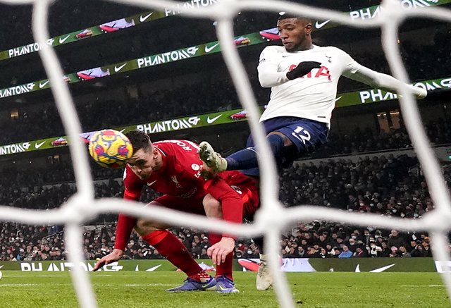 19 December 2021, United Kingdom, London: Liverpool's Andrew Robertson (L) scores his side's second goal during the English Premier League soccer match between Tottenham Hotspur and Liverpool at the Tottenham Hotspur Stadium. Photo: Adam Davy/PA Wire/dpa