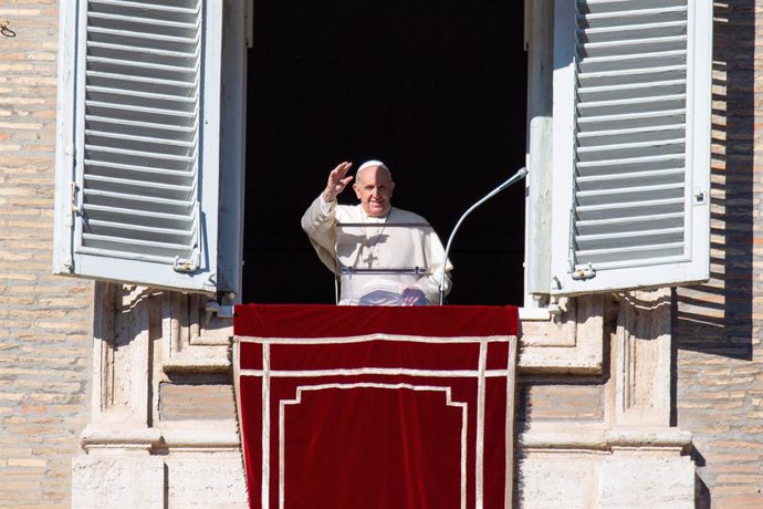 19 December 2021, Vatican, Vatican City: Pope Francis delivers the Sunday Angelus prayer from the window of the Apostolic Palace overlooking St. Peter's Square in Vatican City.  Pope Francis has called for military disarmament and fairer working conditi