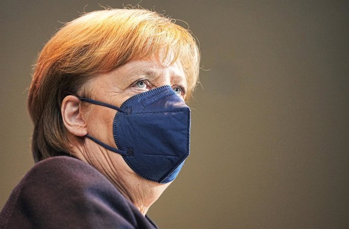 08 December 2021, Berlin: Former German Chancellor Angela Merkel attends the handover ceremony for newly appointed Chancellor Olaf Scholz, at the Federal Chancellery. Photo: Michael Kappeler/dpa