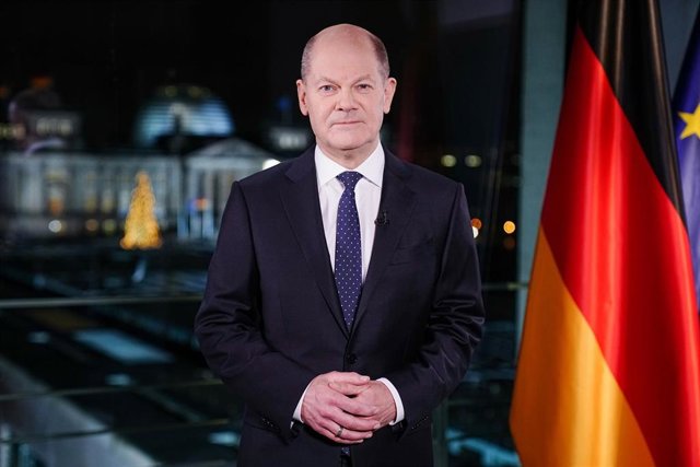 30 December 2021, Berlin: German Chancellor Olaf Scholz (SPD) poses for photographers at the Chancellery during the recording of his New Year's speech for 2022. Photo: Kay Nietfeld/dpa-POOL/dpa