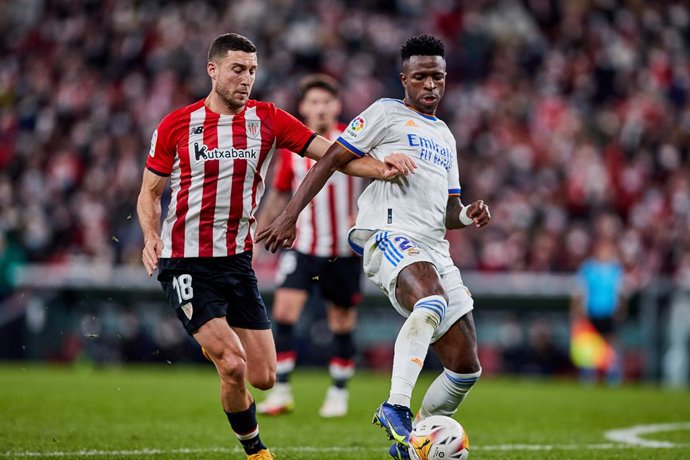 Oscar De Marcos of Athletic Club and Vinicius Junior of Real Madrid CF in action during the Spanish league, La Liga Santander, football match played between Athletic Club and Real Madrid CF at San Mames stadium on December 22, 2021 in Bilbao, Spain.