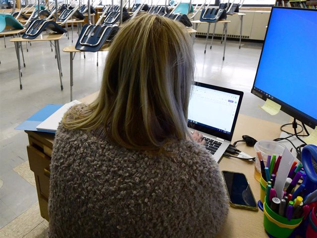NANCY CORNELL works in her empty classroom at Jerstad-Agerholm K-8 School in Racine, Wisconsin
