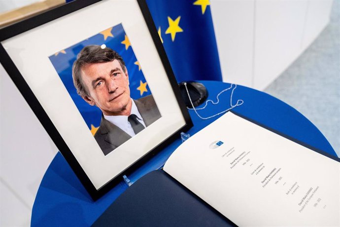 HANDOUT - 11 January 2022, Belgium, Brussels: A picture of the President of the European Parliament, David Sassoli, and a condolence book are being set on a condolence table at the European Parliament in Brussels. Sassoli has died at the age of 65. Phot